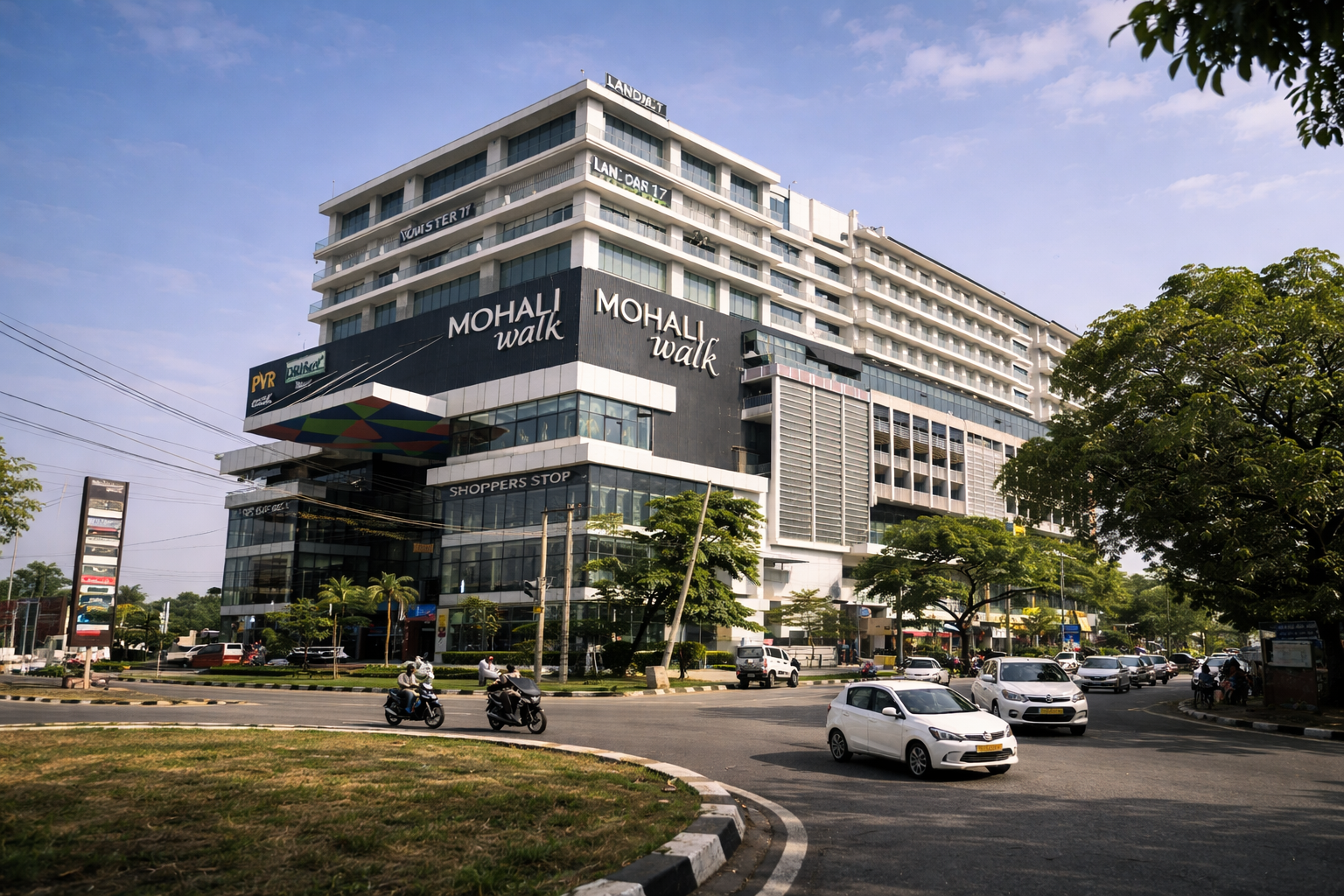 Mohali Walk commercial complex with retail stores and traffic showing urban development and real estate growth in Mohali 2026